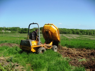 Soil moved from new greenhouse site